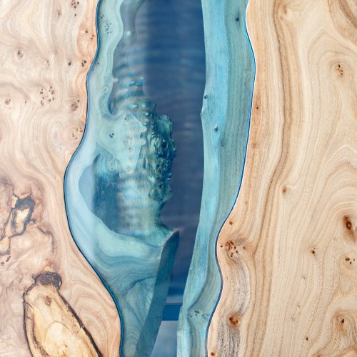 Texture of a wooden table with epoxy resin. Top view of wood for background.